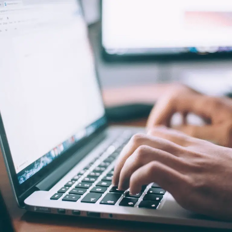 person typing computer