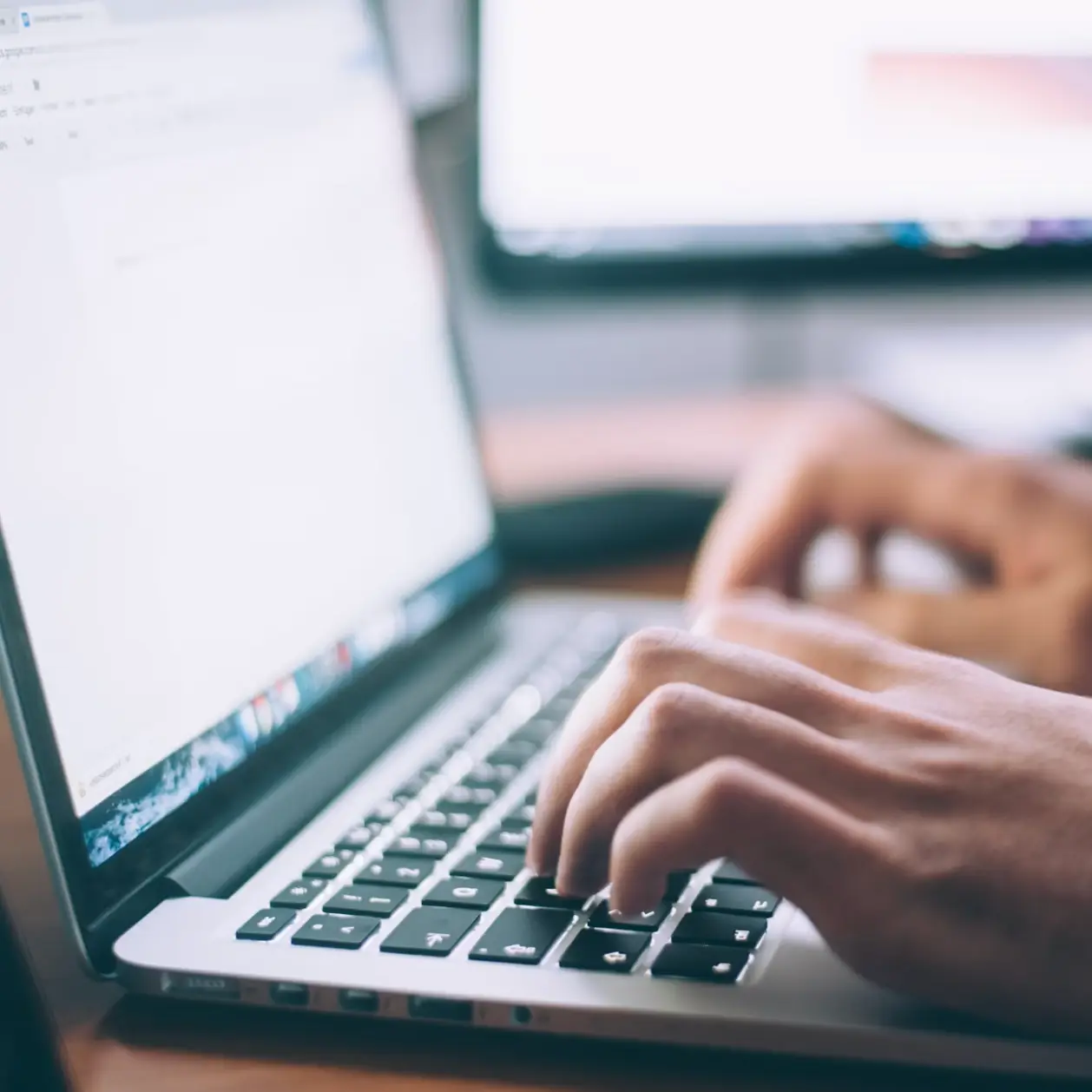 person typing computer